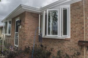 brick home exterior with casement window